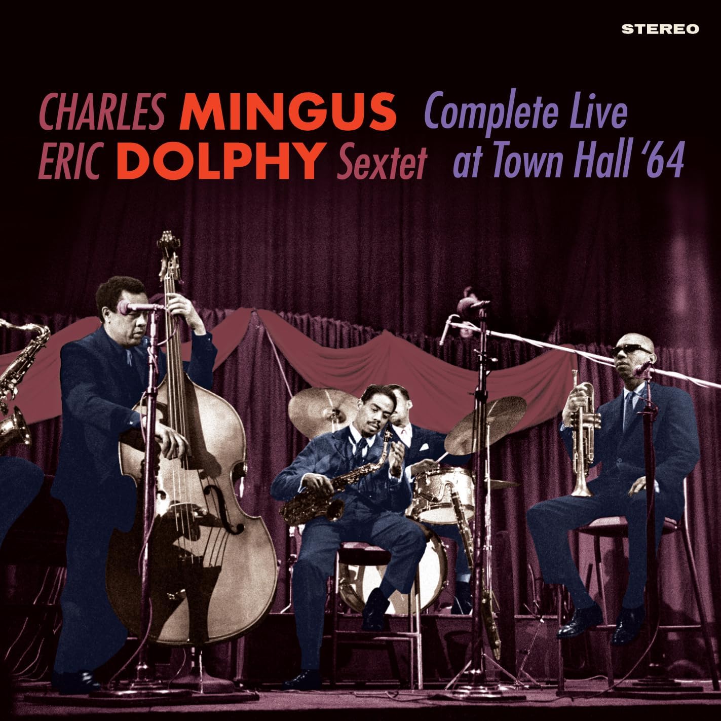 Jazz musicians Charles Mingus and Eric Dolphy performing live on stage.