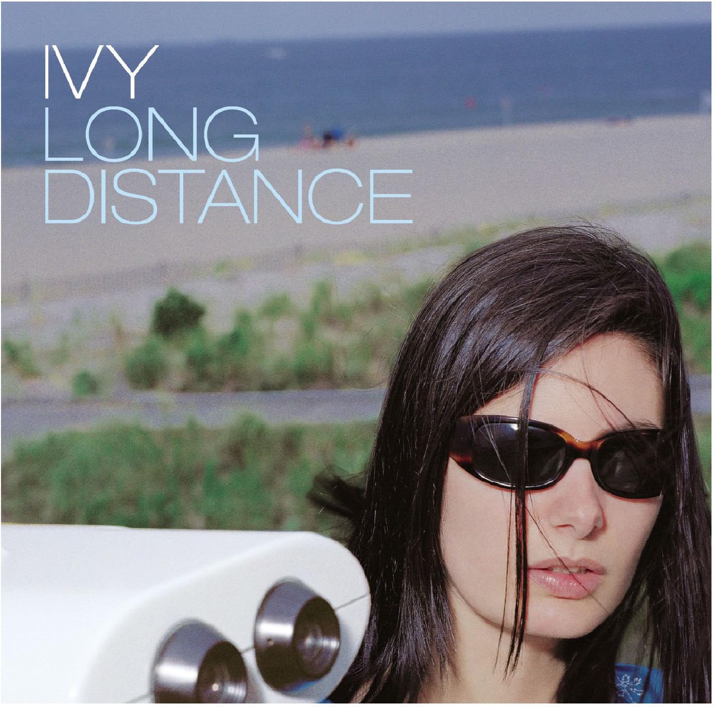 Album cover for Ivy’s “Long Distance” featuring a woman in sunglasses.