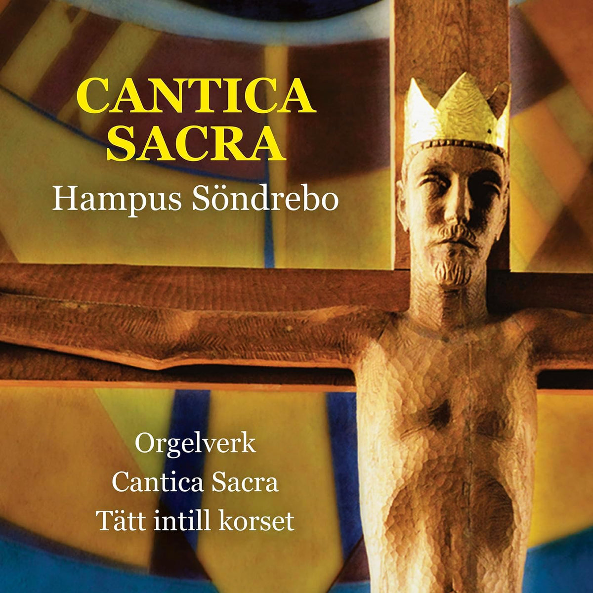 CD cover: carved face on cross, gold text “CANTICA SACRA”.