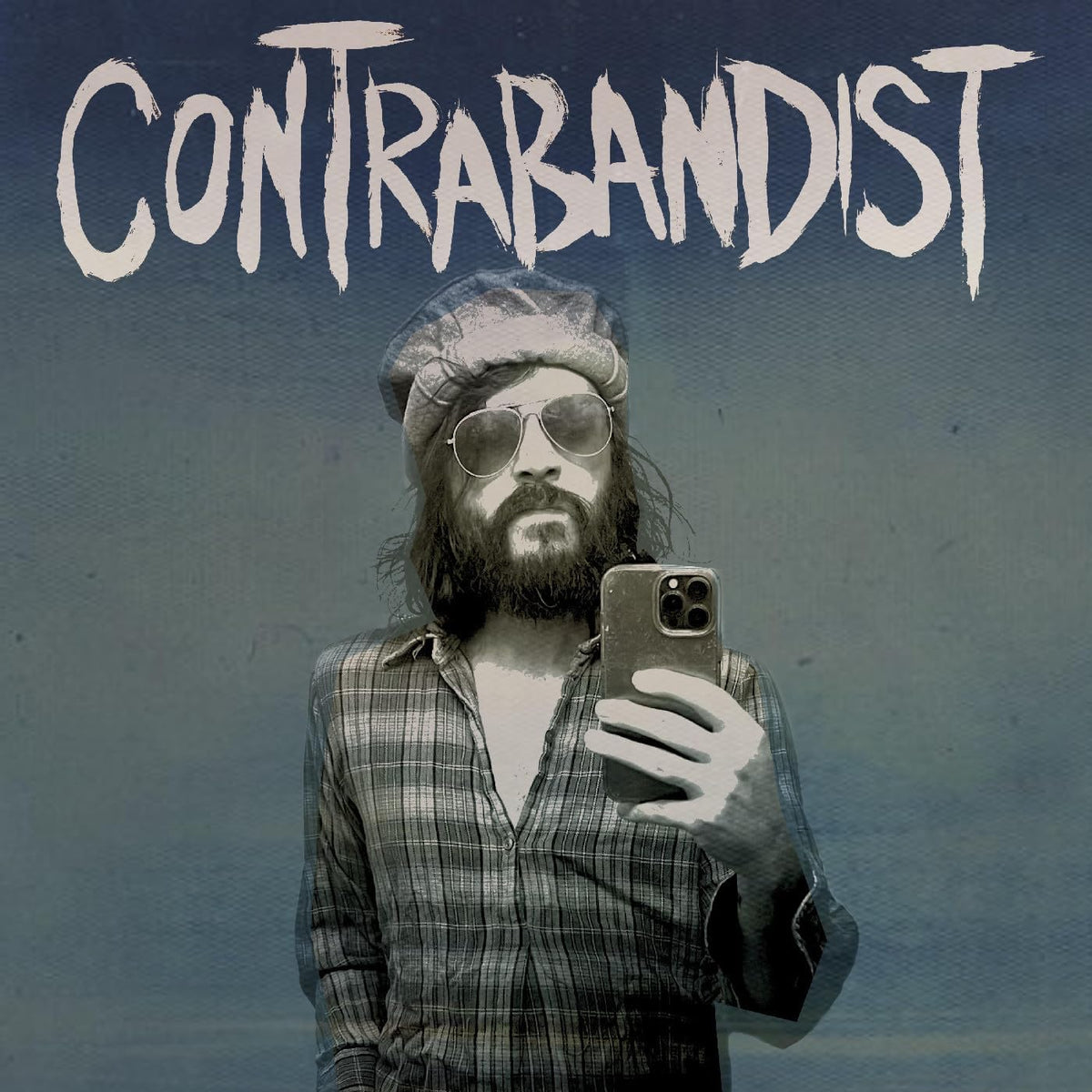 Album cover: bearded man taking a selfie with a phone.