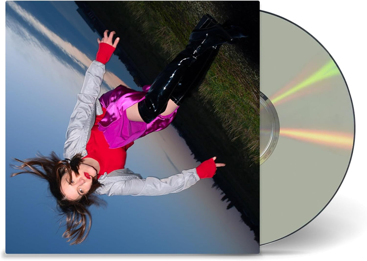 CD cover featuring a person in bright clothing falling backwards.