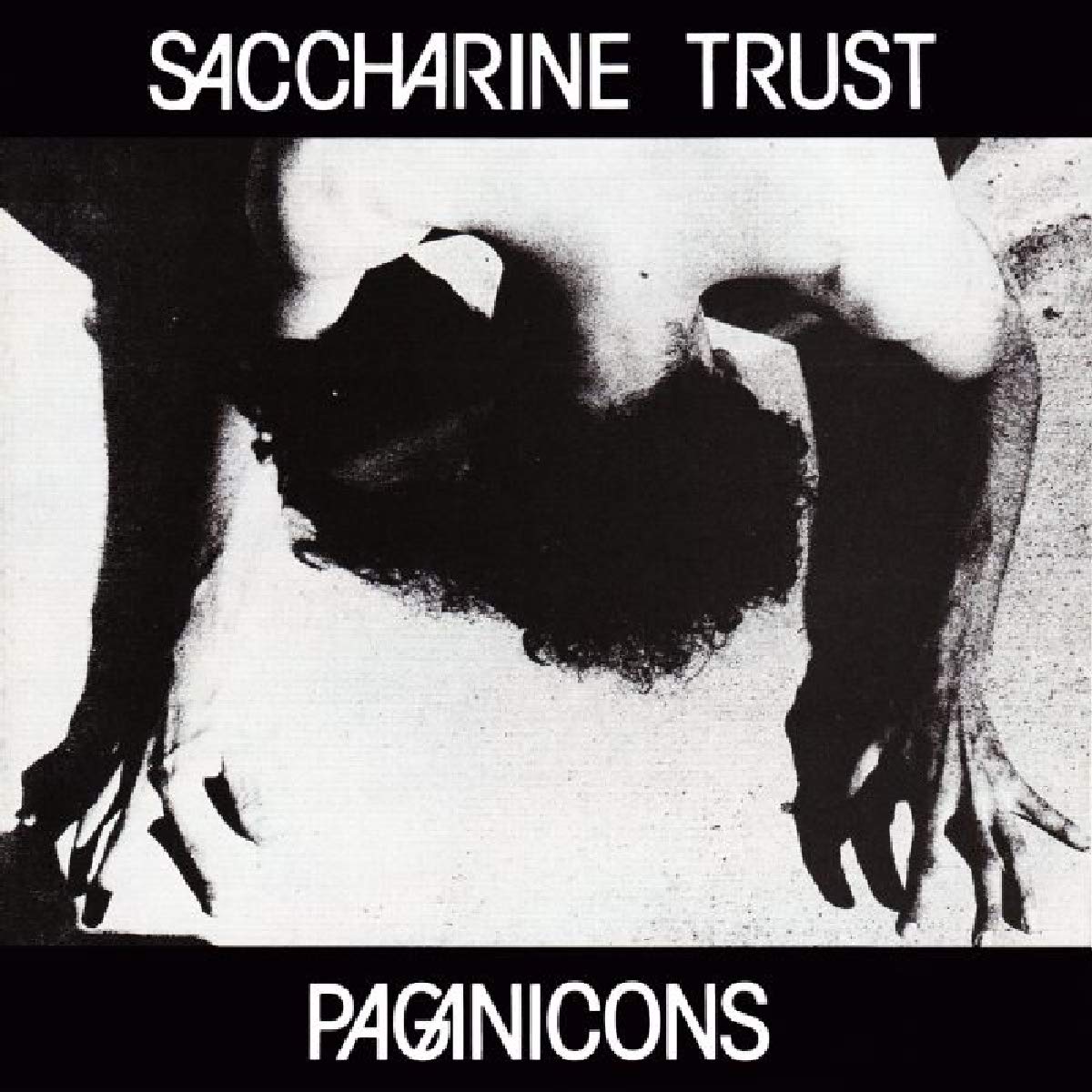 Black and white CD cover with obscured face and text “Saccharine Trust”.
