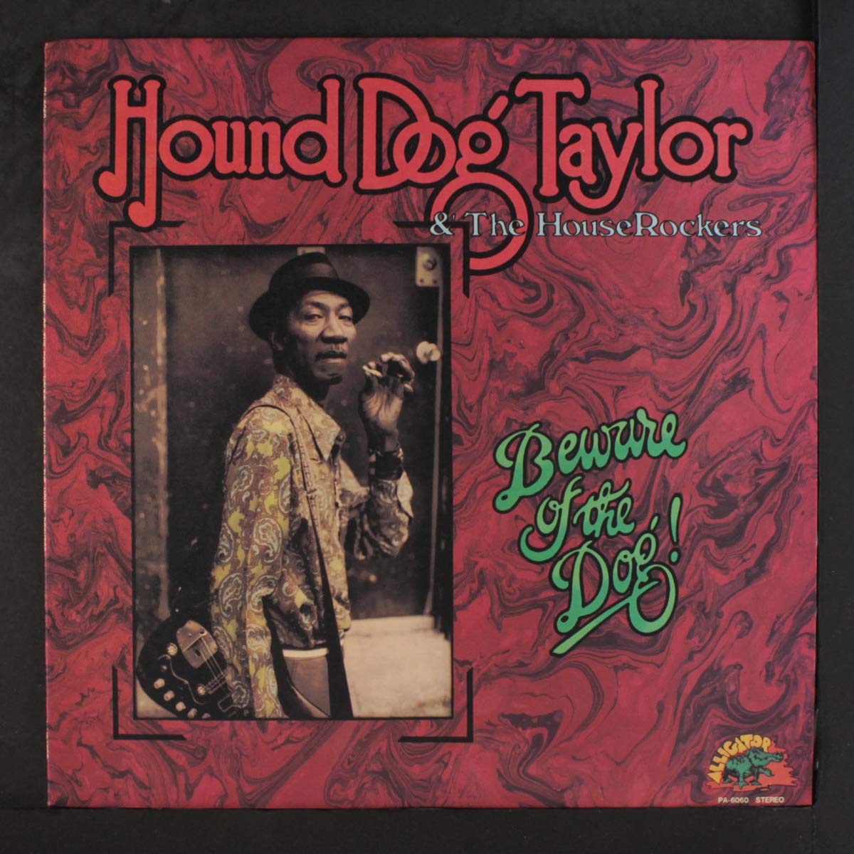 Hound Dog Taylor album cover featuring a portrait of the musician.