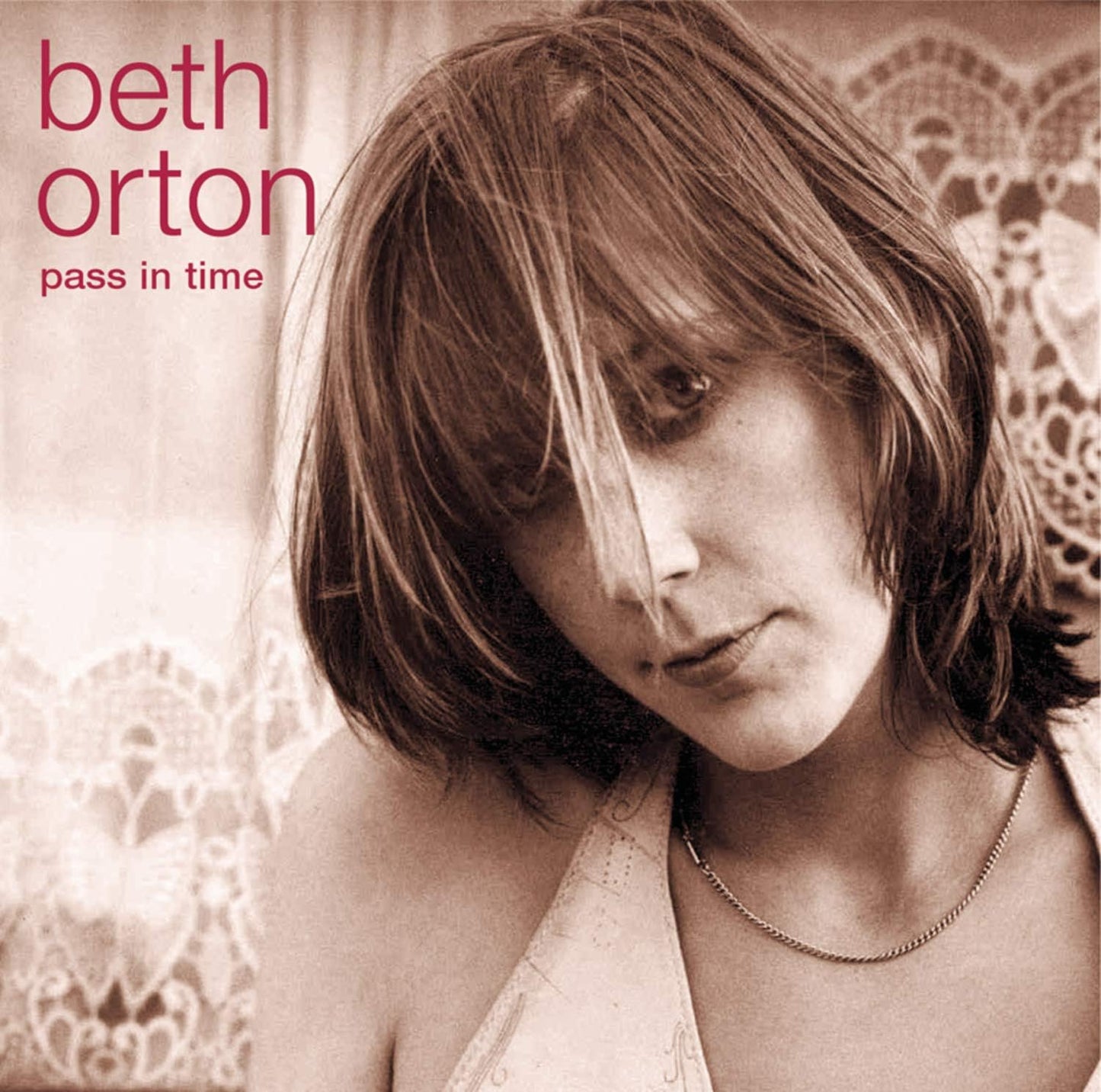 Beth Orton album cover: sepia-toned portrait with lace detail.