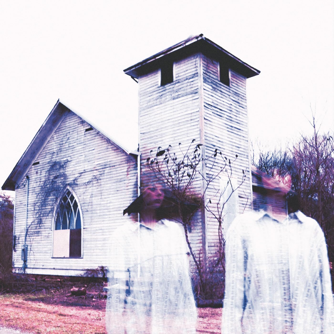 Old wooden church with ghostly figures in front, faded purple tone.