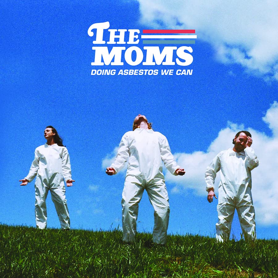 Album cover for The Moms: three figures in white suits on grass.