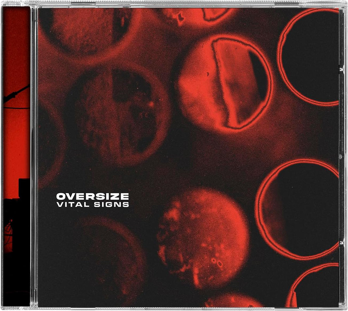 CD case with abstract red and black image of blurred circles.