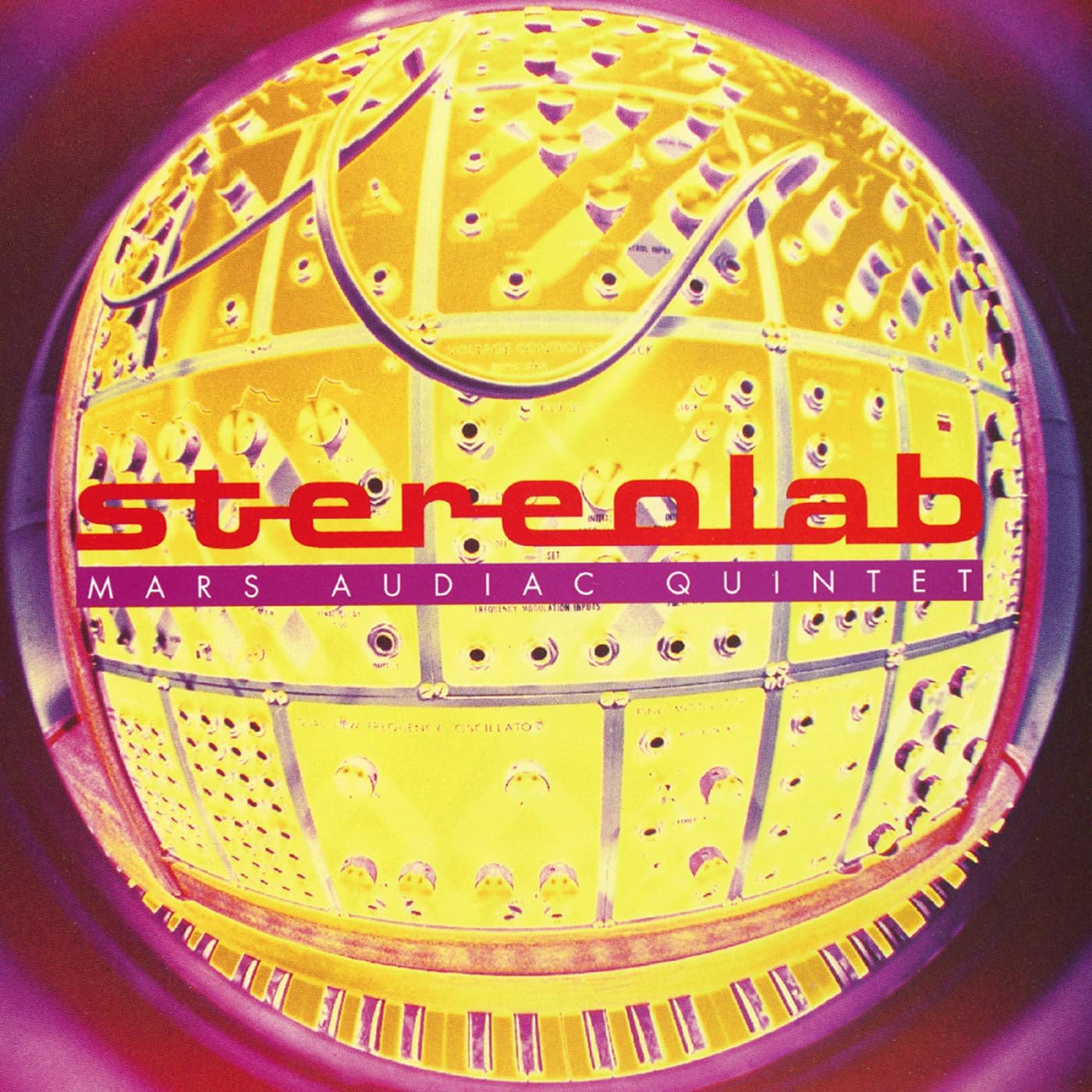 Fisheye view of a yellow modular synthesizer with Stereolab Mars Audiac Quintet text overlay.