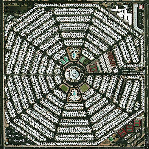 Aerial view of a housing development in a geometric, star-like pattern.