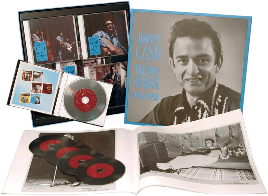 CD box set featuring Johnny Cash photos, a disc, and an open booklet.