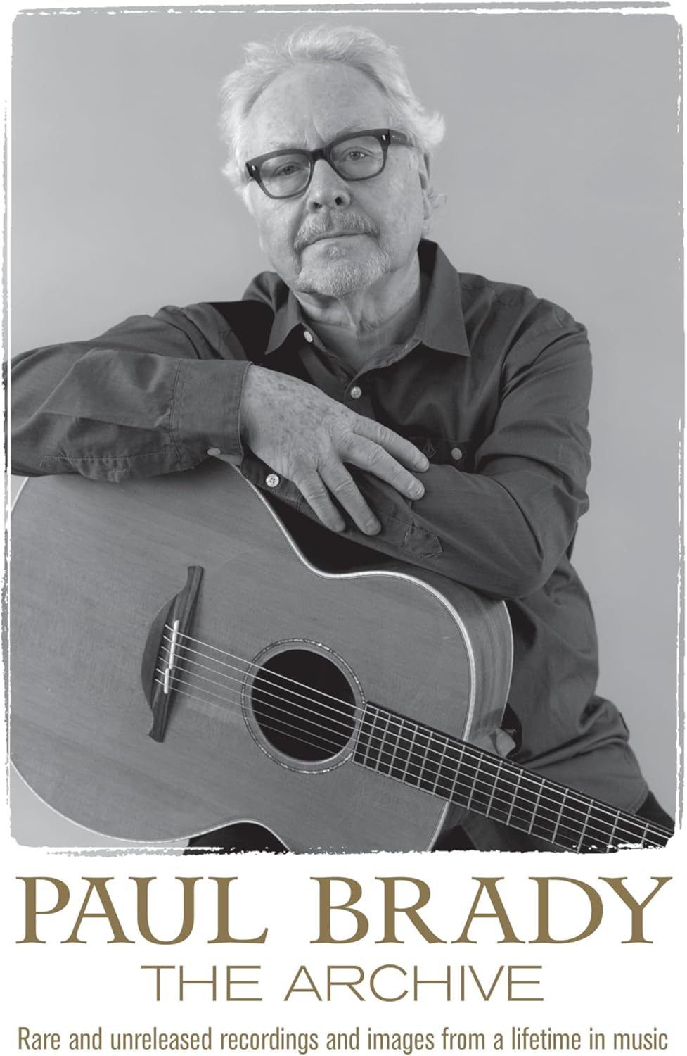 Paul Brady with acoustic guitar, album cover for "The Archive.