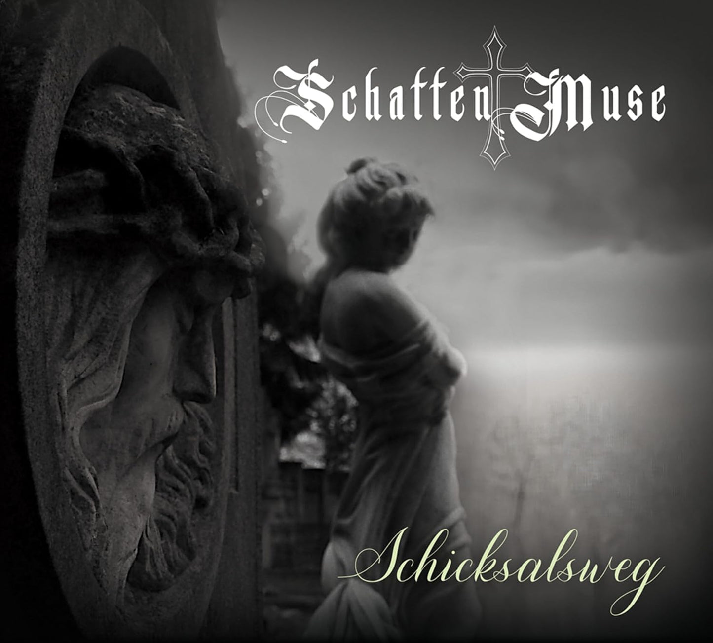 Black and white album cover featuring statues and ornate lettering.