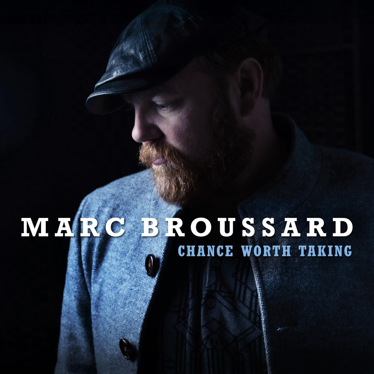 Man in cap and coat, album cover for Marc Broussard.