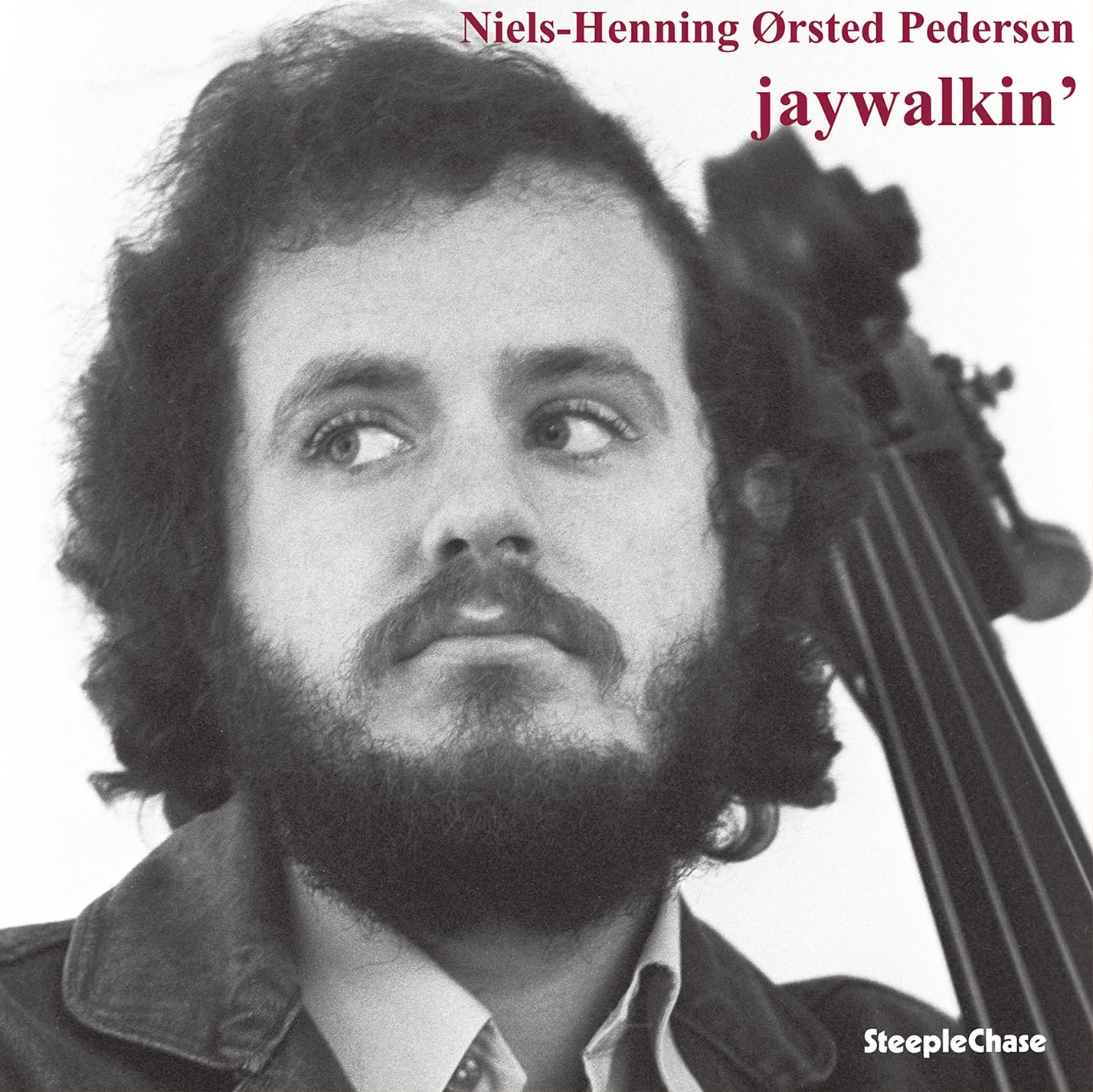 Black and white portrait of Niels-Henning Ørsted Pedersen with his double bass.