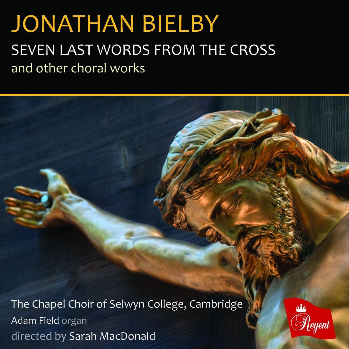 CD cover featuring a bronze sculpture of Christ on the cross.