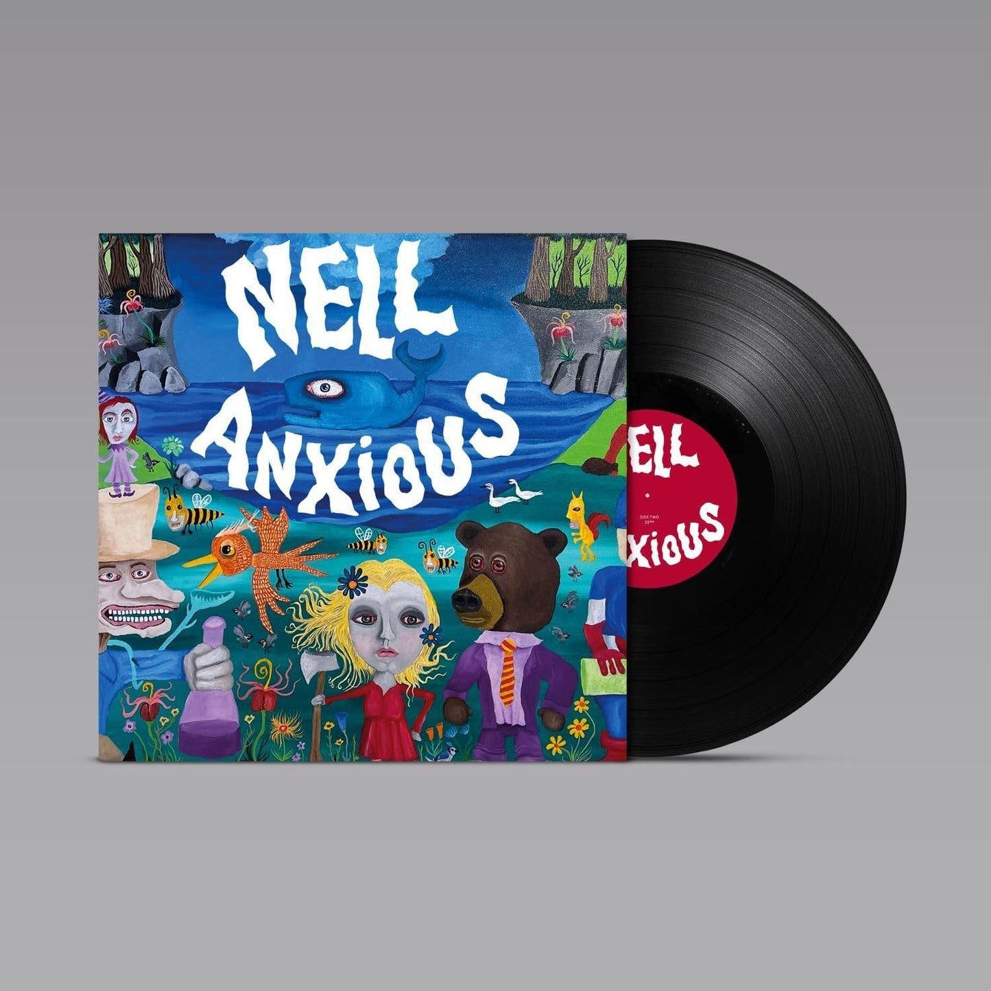 Vinyl record and cover art featuring surreal, colorful illustrations of characters and a blue whale.