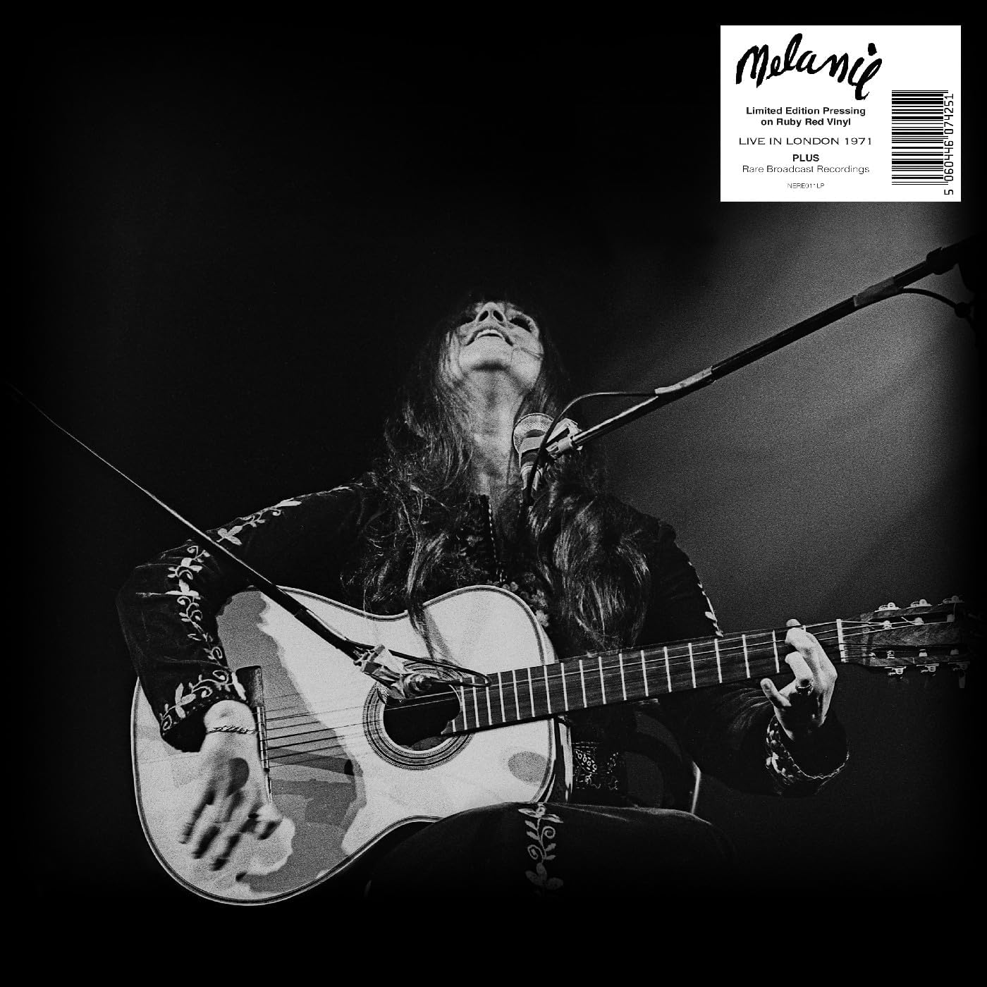 Black and white vinyl record cover featuring Melanie performing with a guitar.