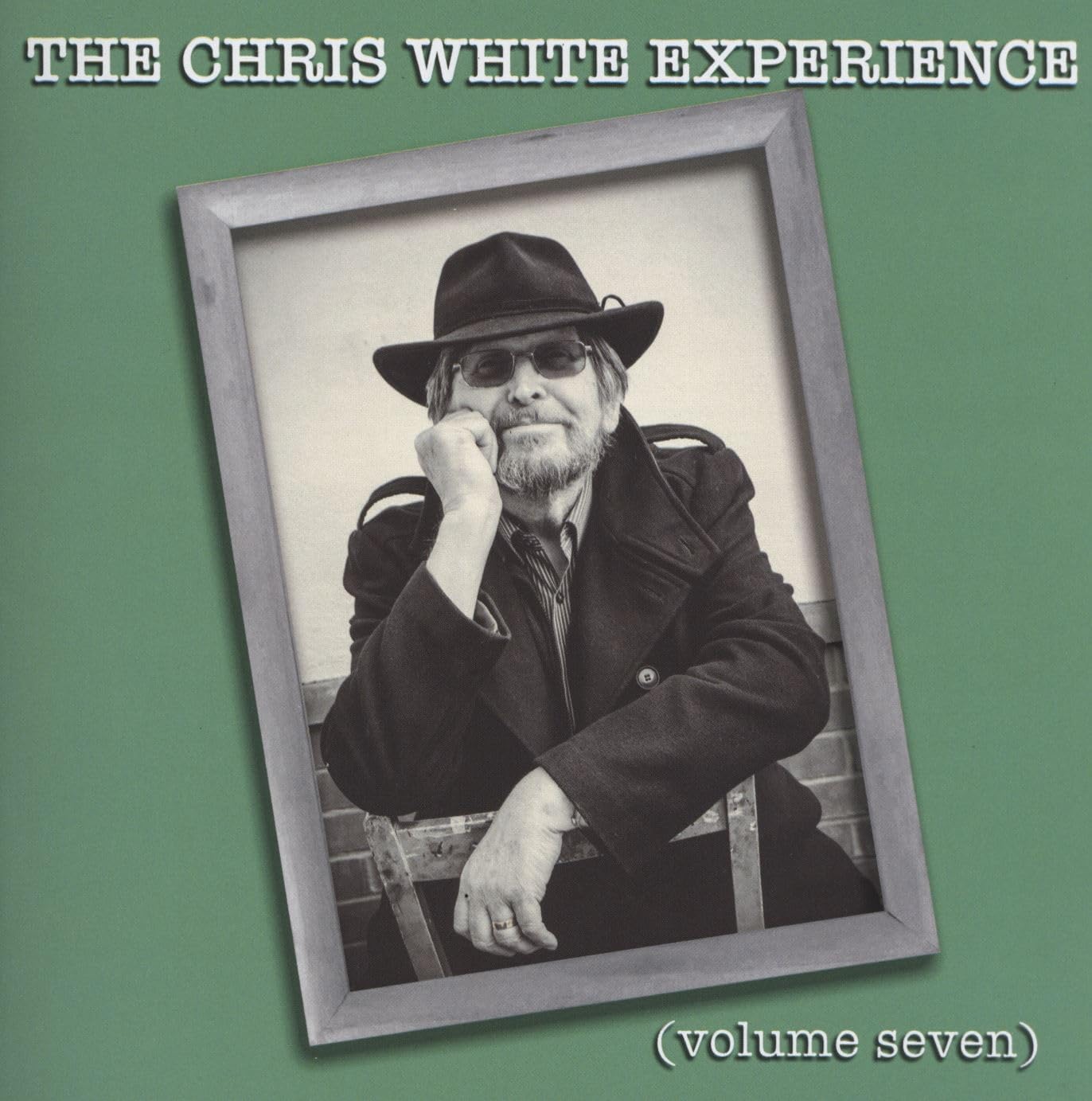 CD cover featuring a black and white portrait of a man in a hat.