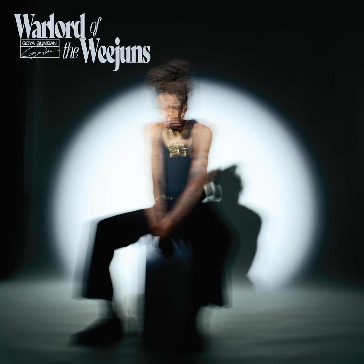 CD cover: blurred figure in dark clothing against a bright background.