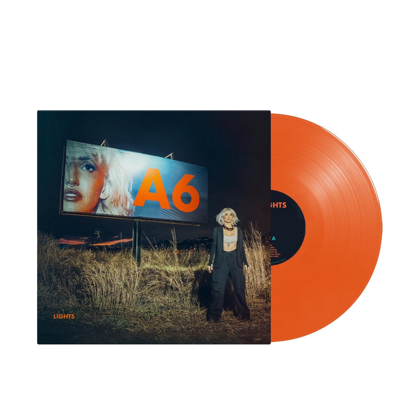 Orange vinyl record with cover art featuring a woman and highway scene.