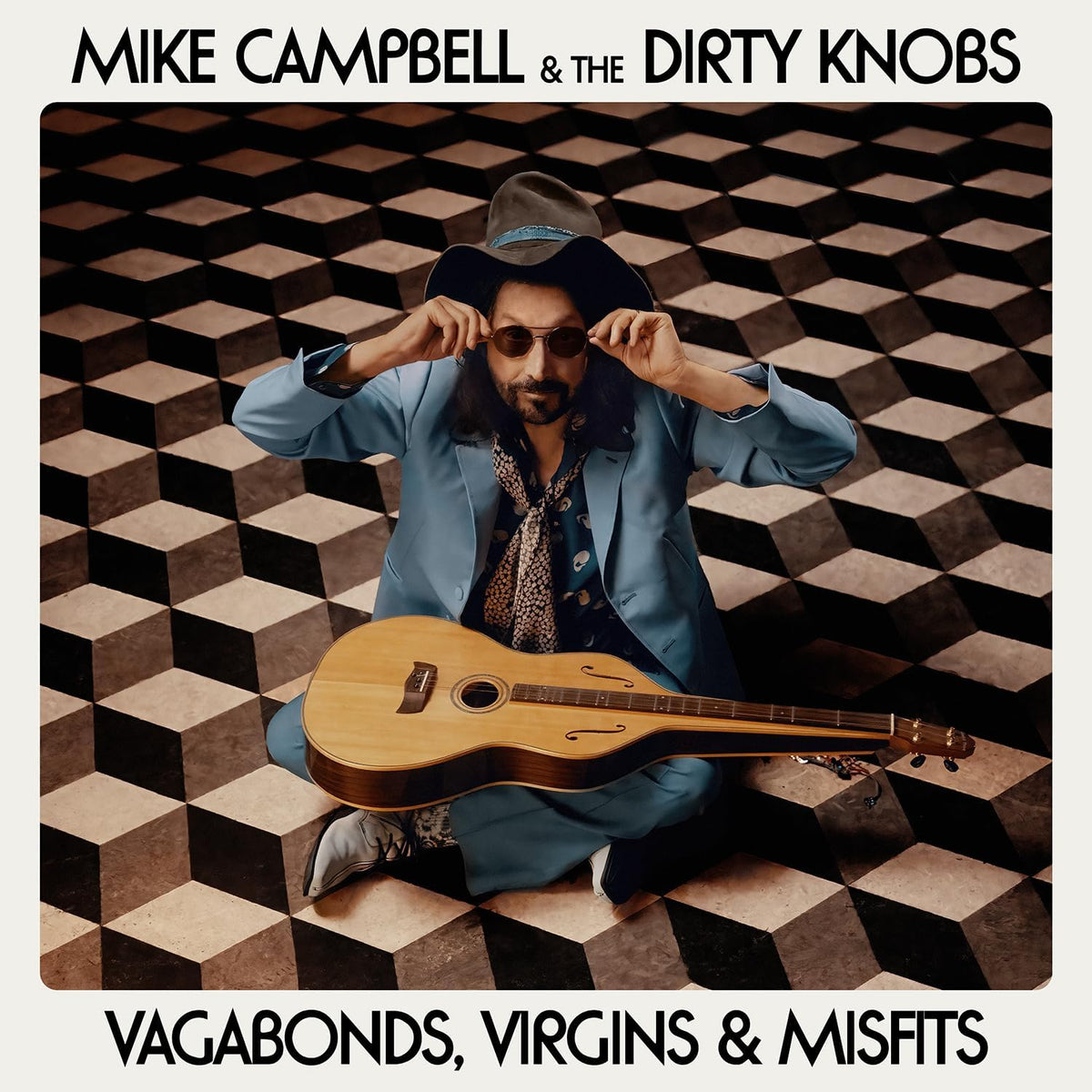 Album cover: Mike Campbell with guitar, seated on checkered floor.
