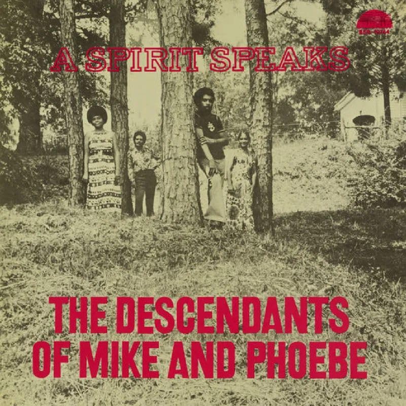 Vintage album cover featuring a family portrait in a wooded area.