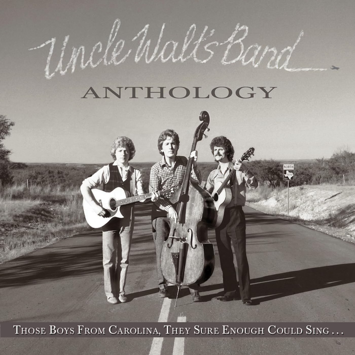 Vintage album cover featuring three musicians with instruments on a road.