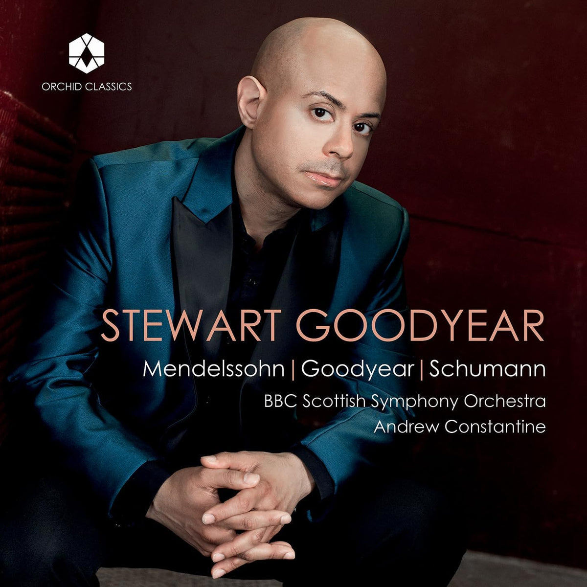 CD cover featuring pianist Stewart Goodyear in a teal suit.