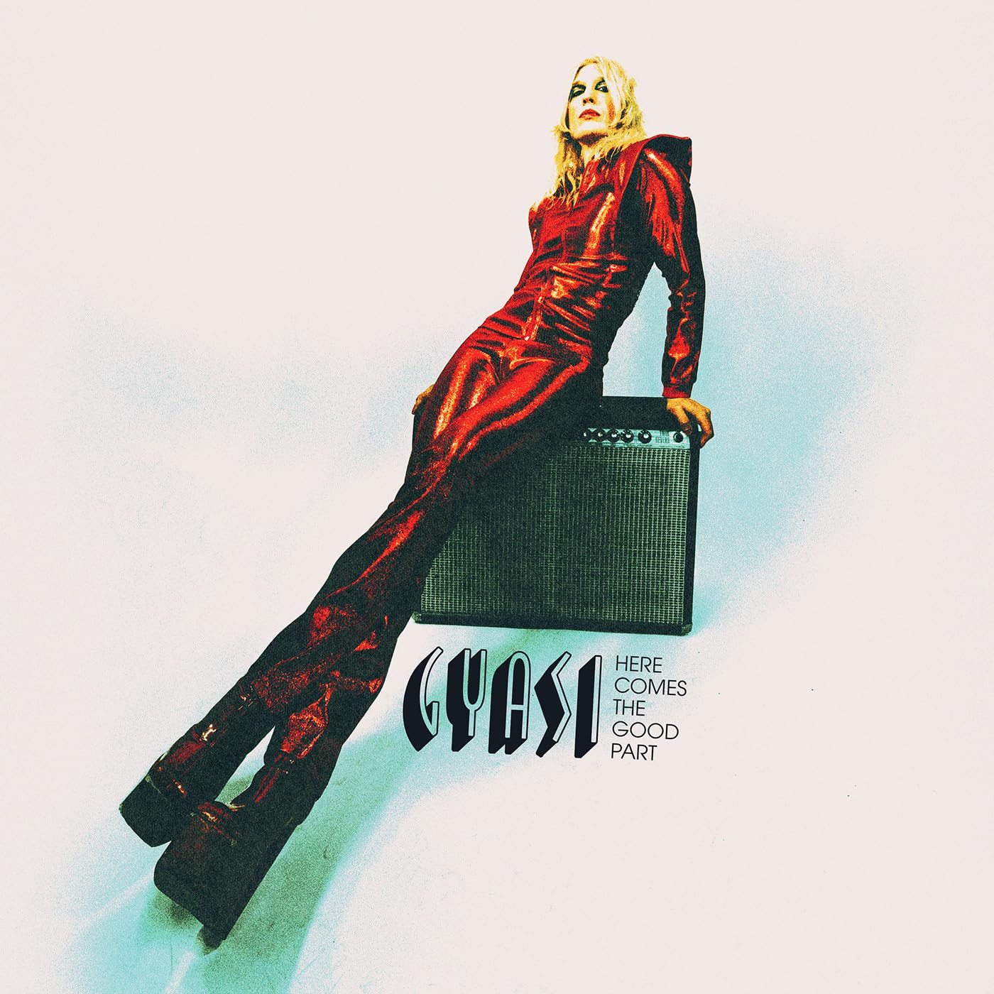 CD cover: woman in red suit leaning on a guitar amplifier.