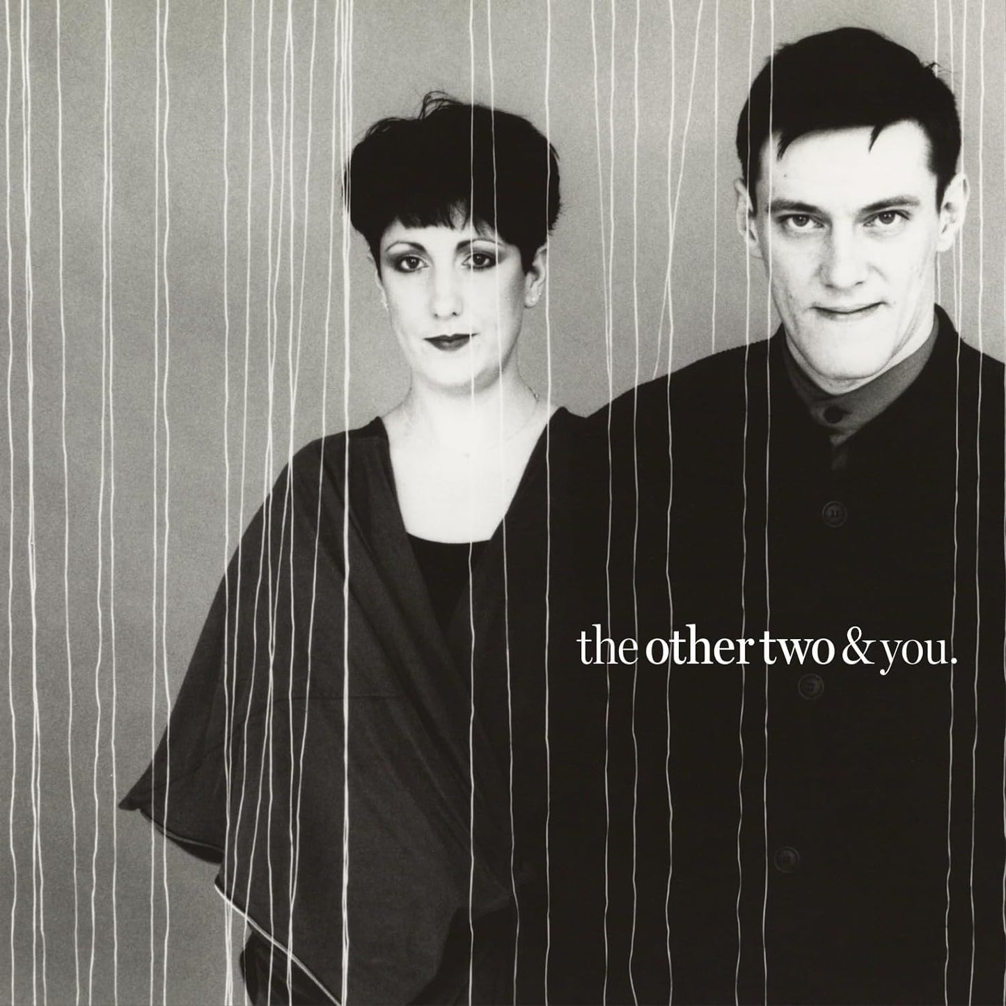 Black and white portrait of a man and woman with vertical lines.