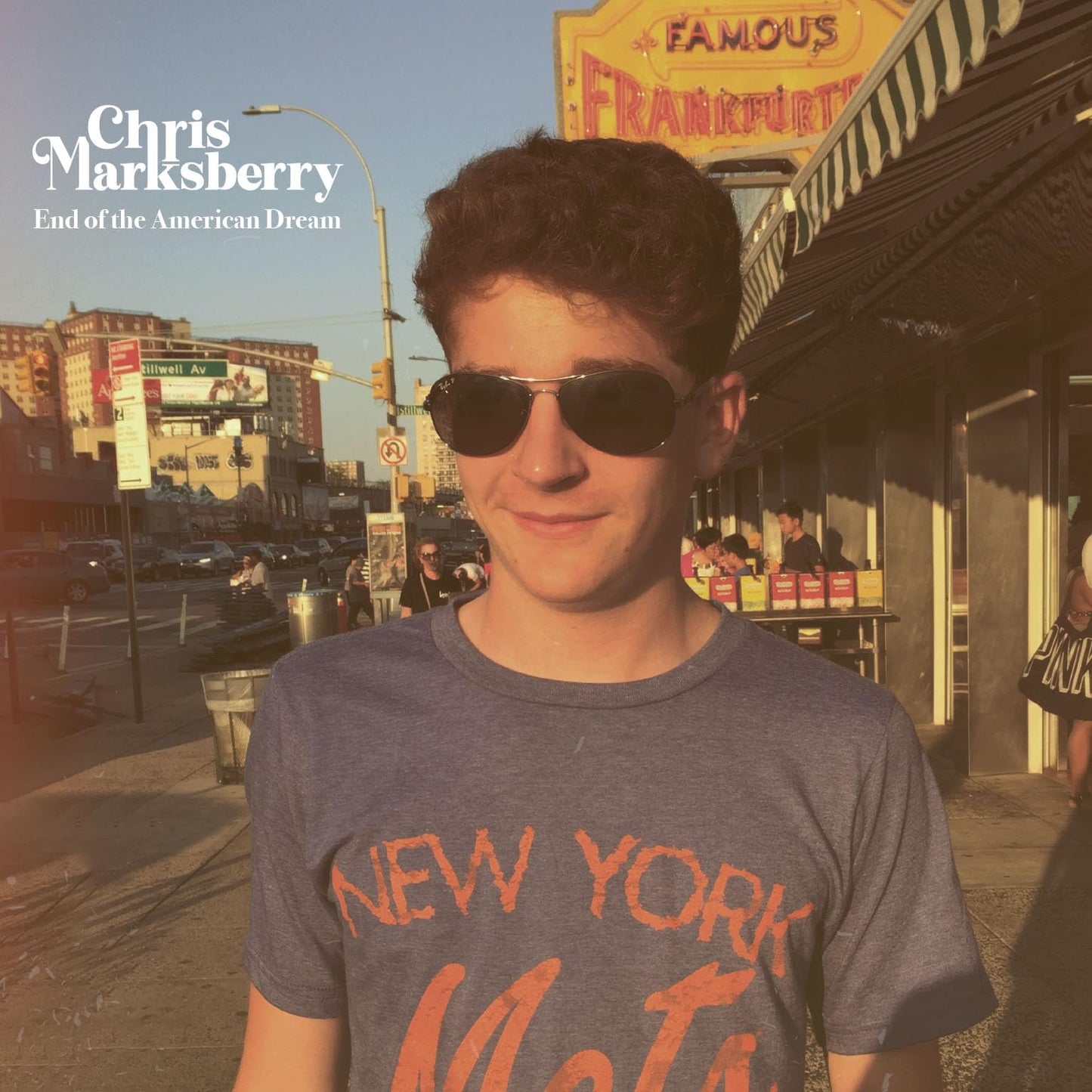 CD cover featuring a young man in sunglasses and a "New York" t-shirt.