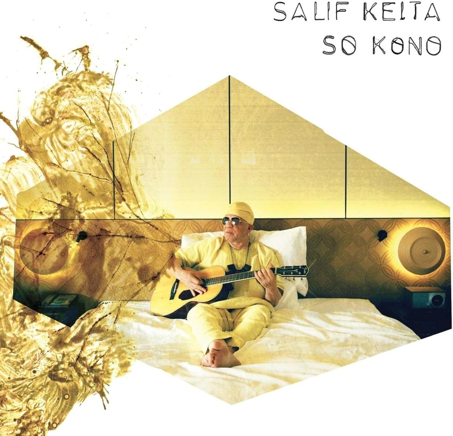 Salif Keita album cover: man with guitar on a bed, hexagonal design.