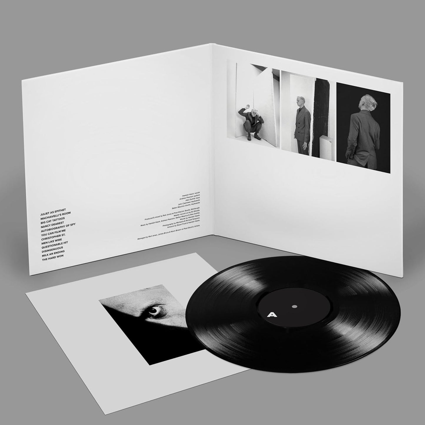 Hamish Hawk vinyl record with album artwork featuring three suited figures.