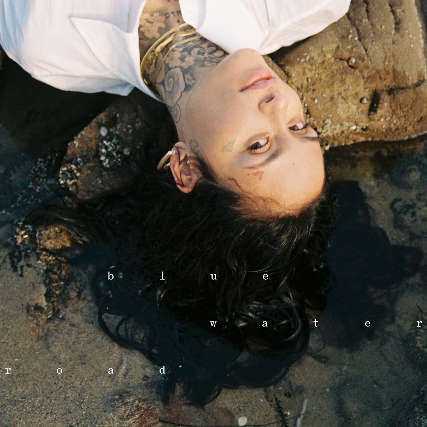 Kehlani album cover, "Blue Water Road," featuring a portrait in water.