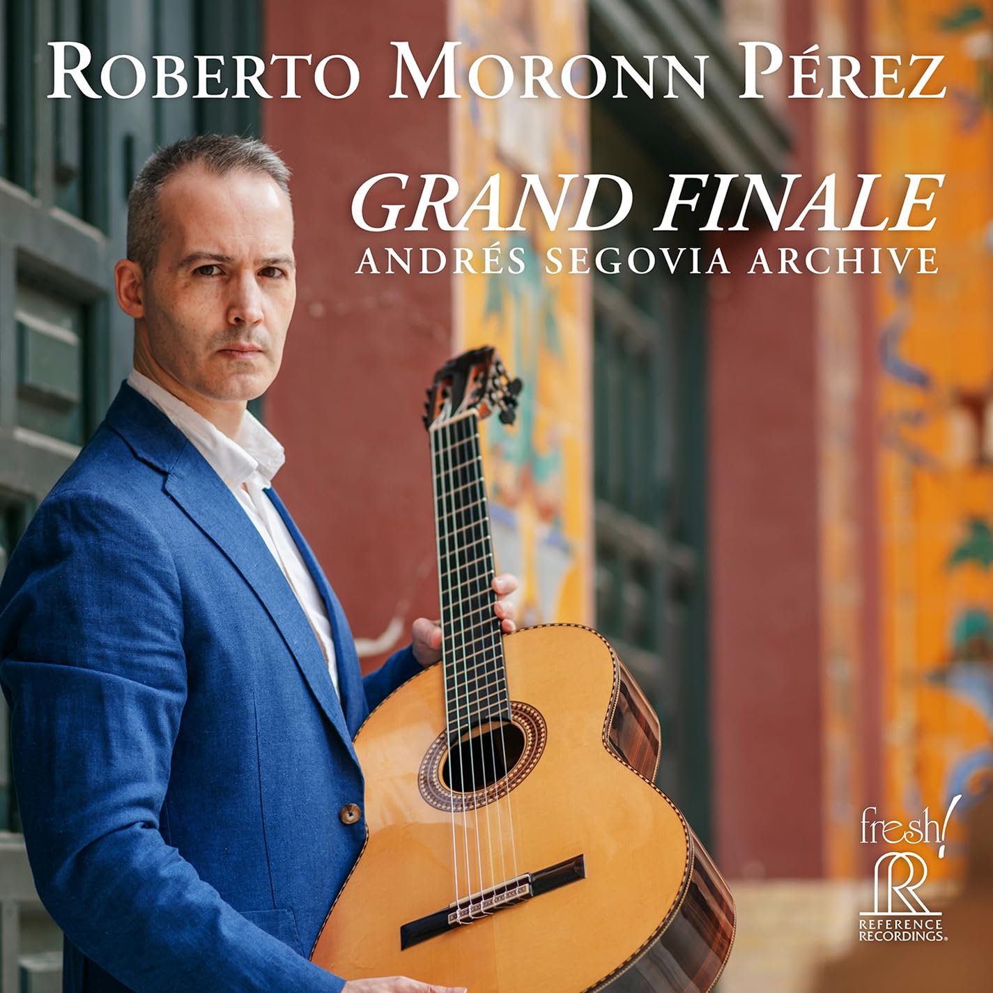 Classical guitarist Roberto Perez holding a guitar, album cover art.