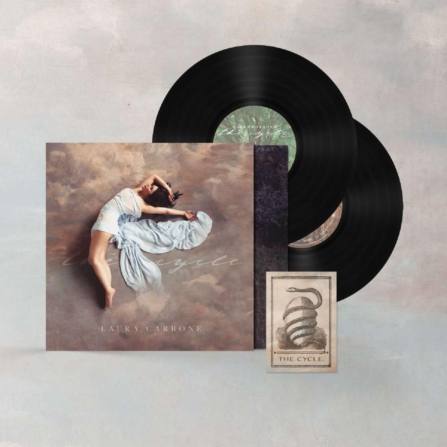 Two vinyl records and album art featuring a dancer in motion.