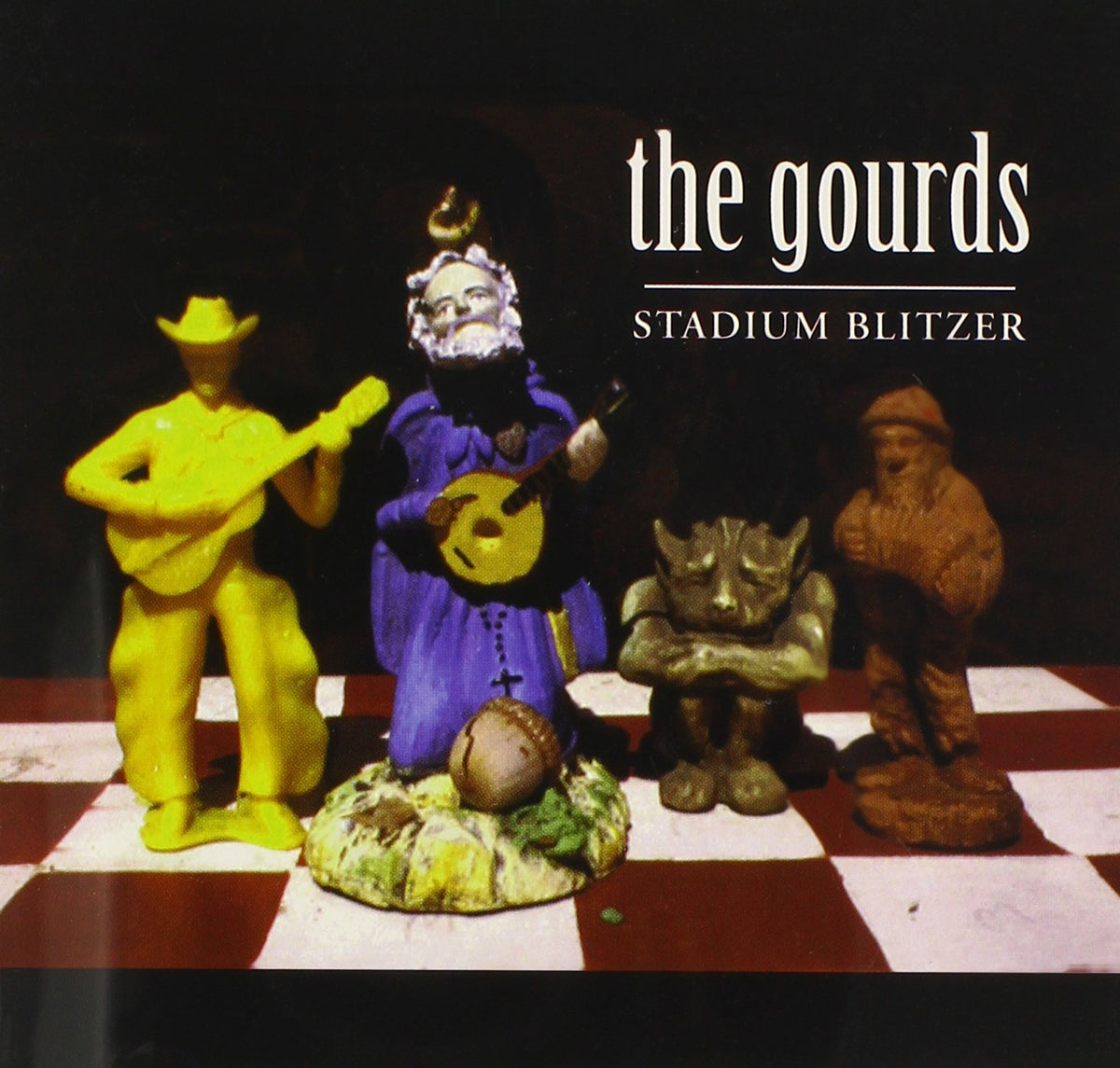 CD cover for The Gourds’ “Stadium Blitzer” featuring painted figurines.