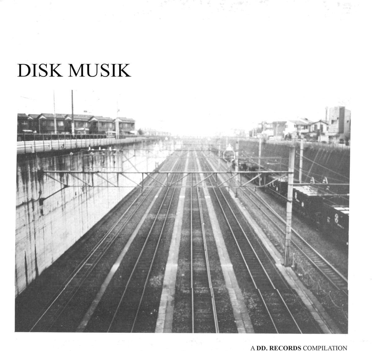 Black and white vinyl record cover with a railway landscape image.