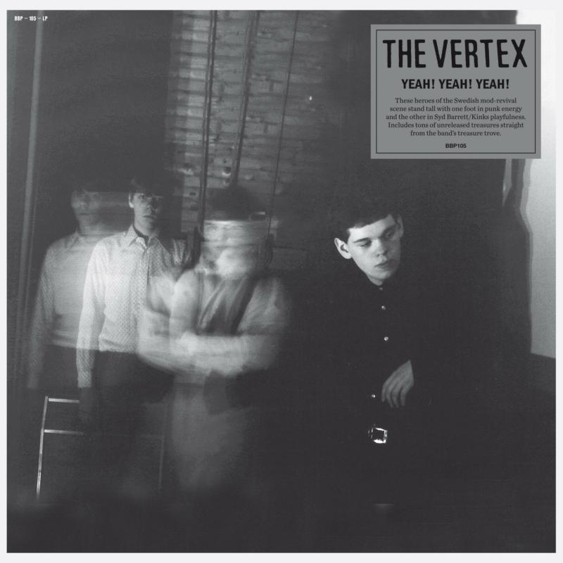 Black and white album cover featuring three young men in a blurred interior.