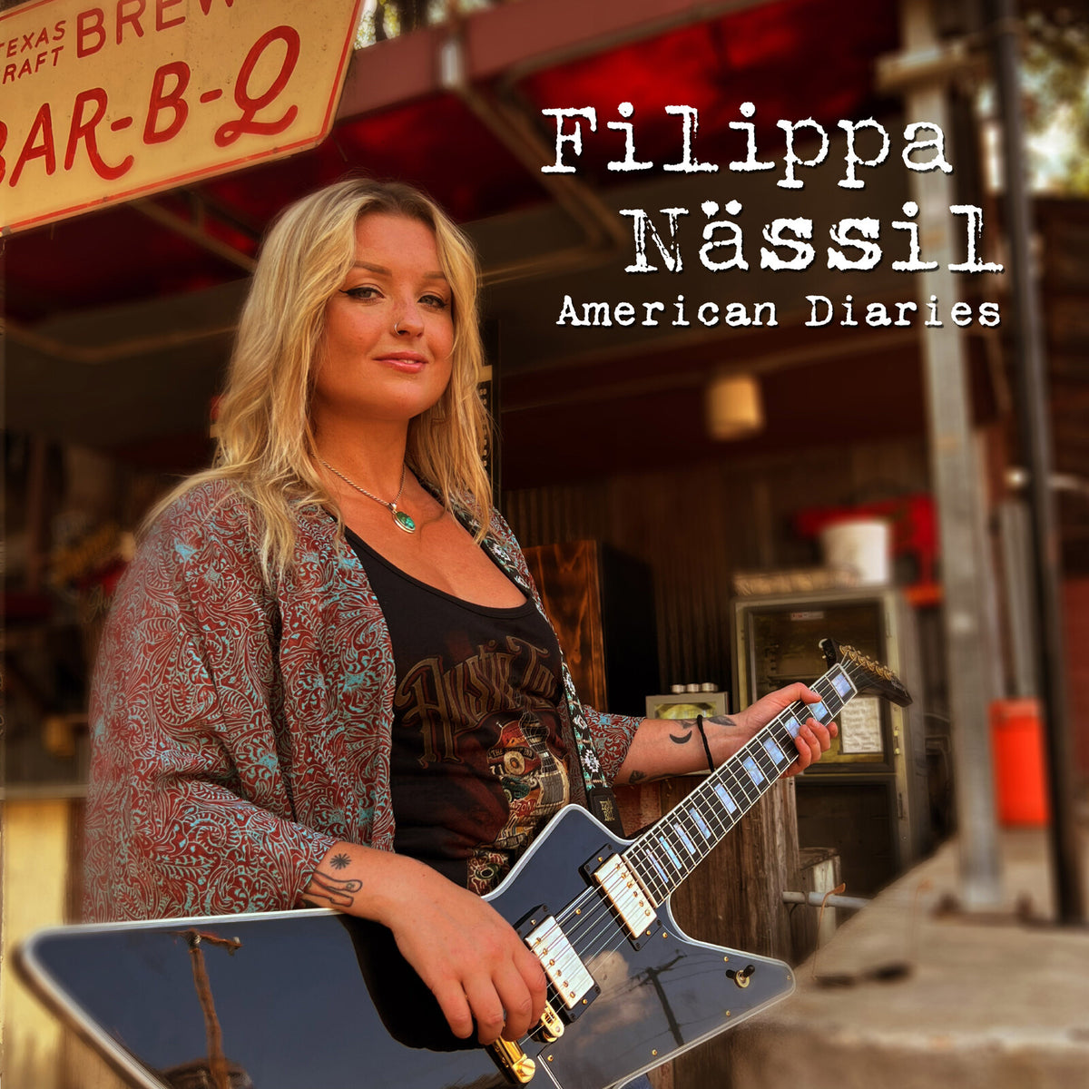 Filippa Nassil album cover featuring a blonde woman with a guitar.
