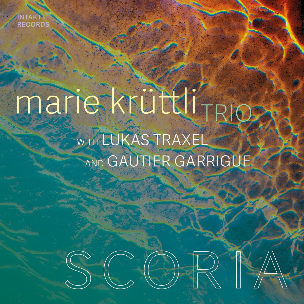 CD cover for Marie Kruttli Trio’s “Scoria” with abstract, textured imagery.