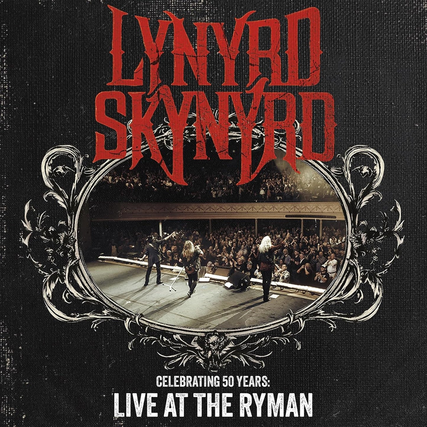 Lynyrd Skynyrd album cover: band performing on stage at Ryman Auditorium.