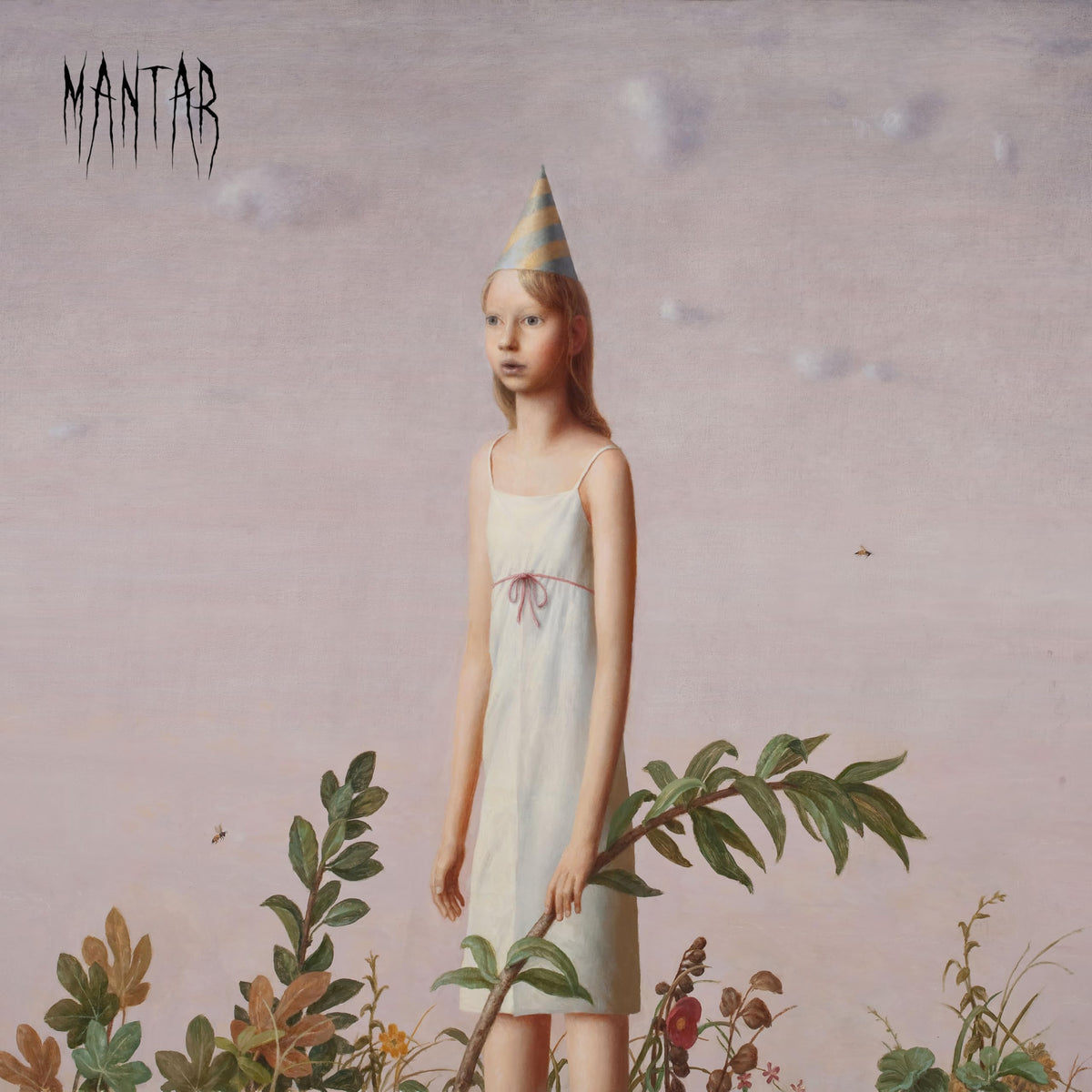 Young girl in a party hat stands amidst overgrown foliage.