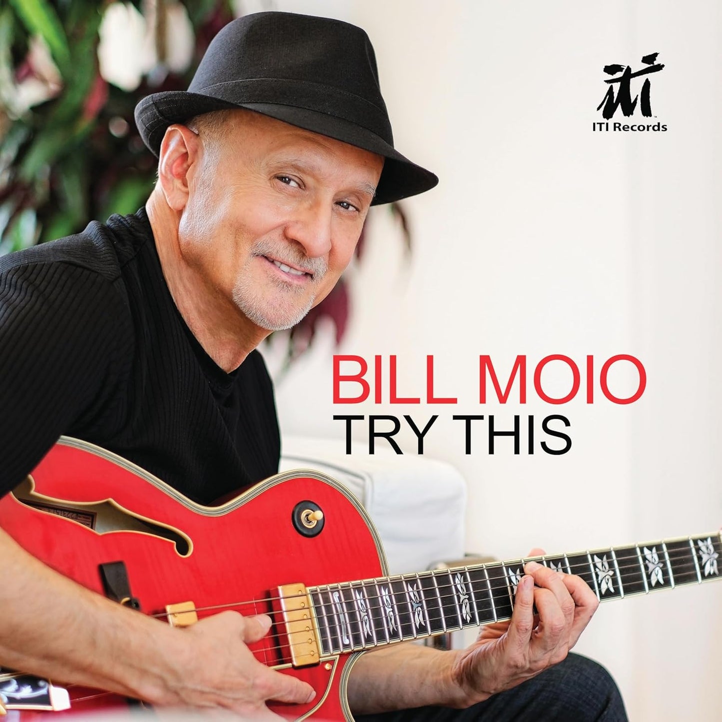 CD cover featuring Bill Moio with a guitar, text “Try This”.