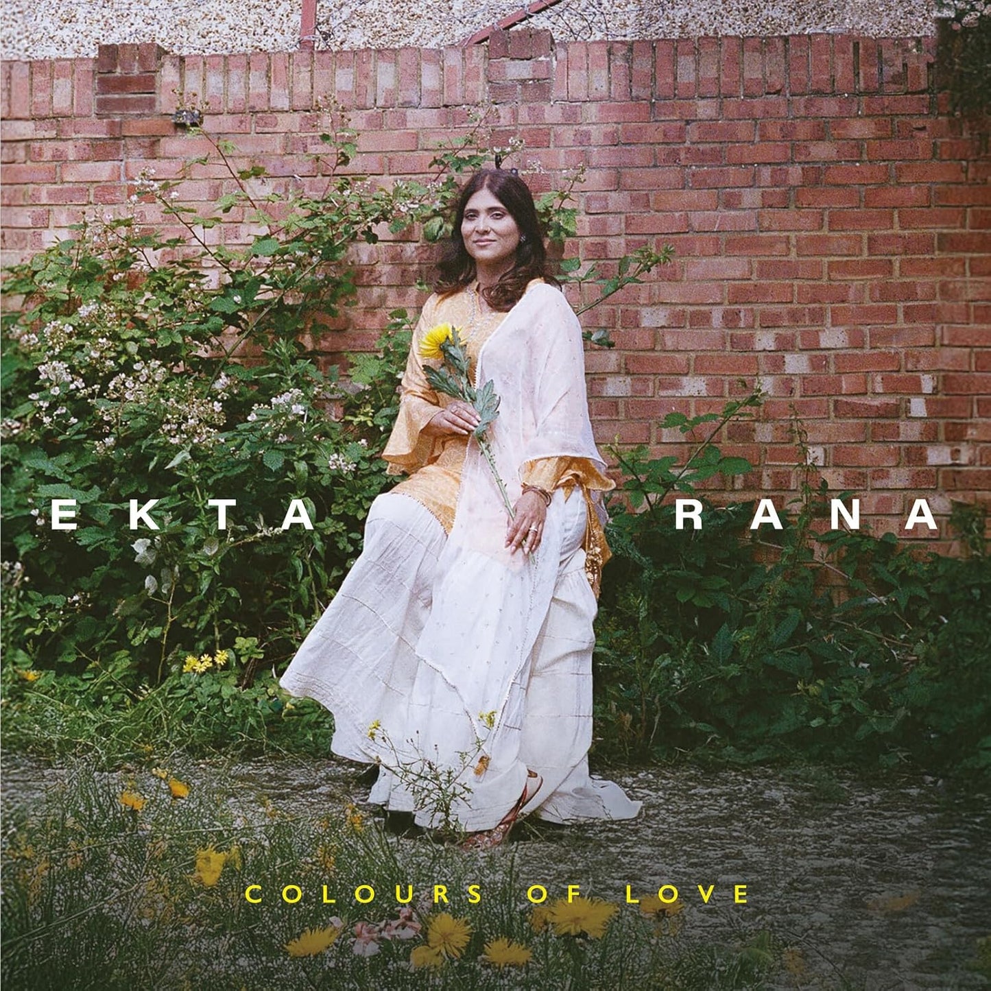 CD cover featuring Ekta Rana in a white dress with yellow flowers.