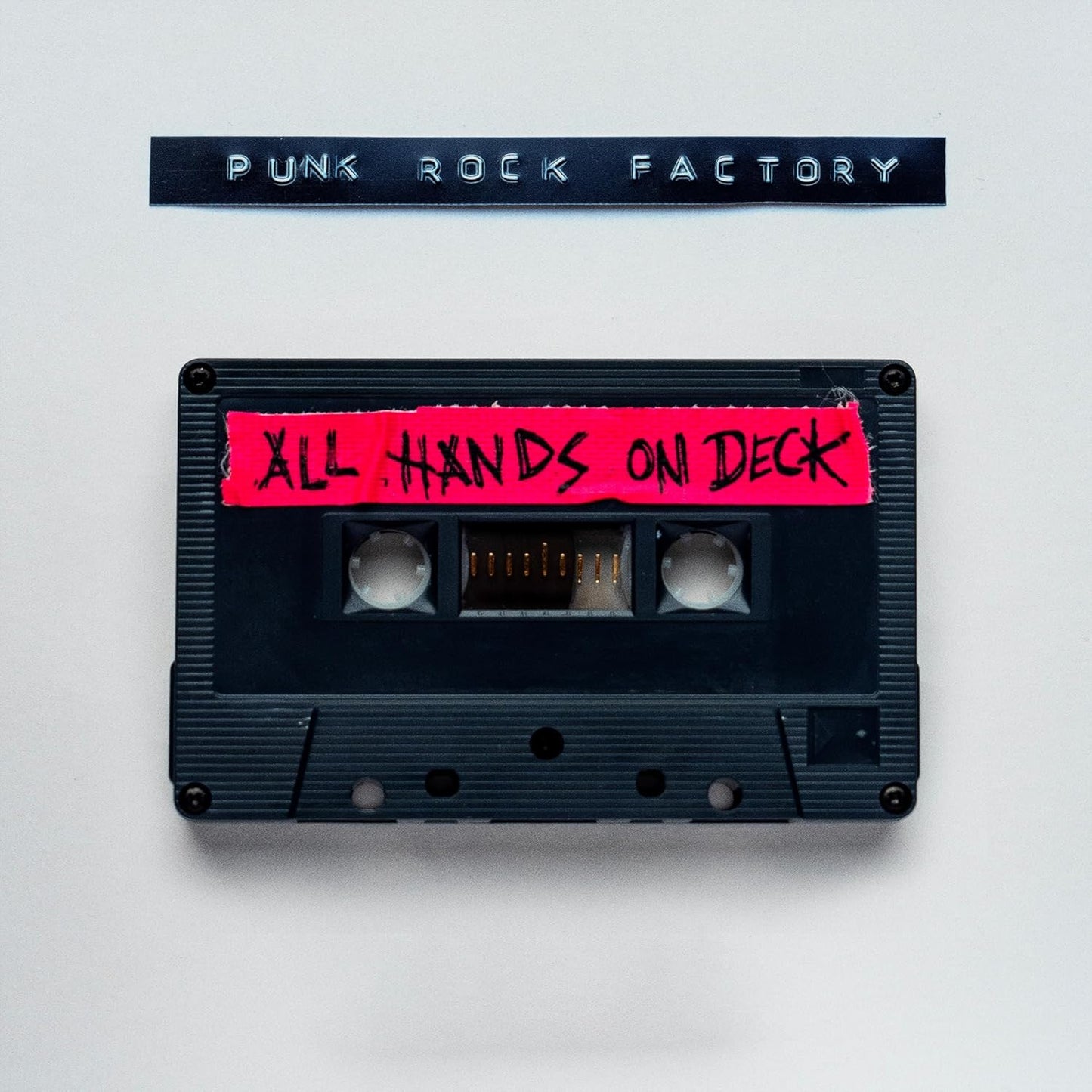 Cassette tape with red handwritten text: "All Hands On Deck".