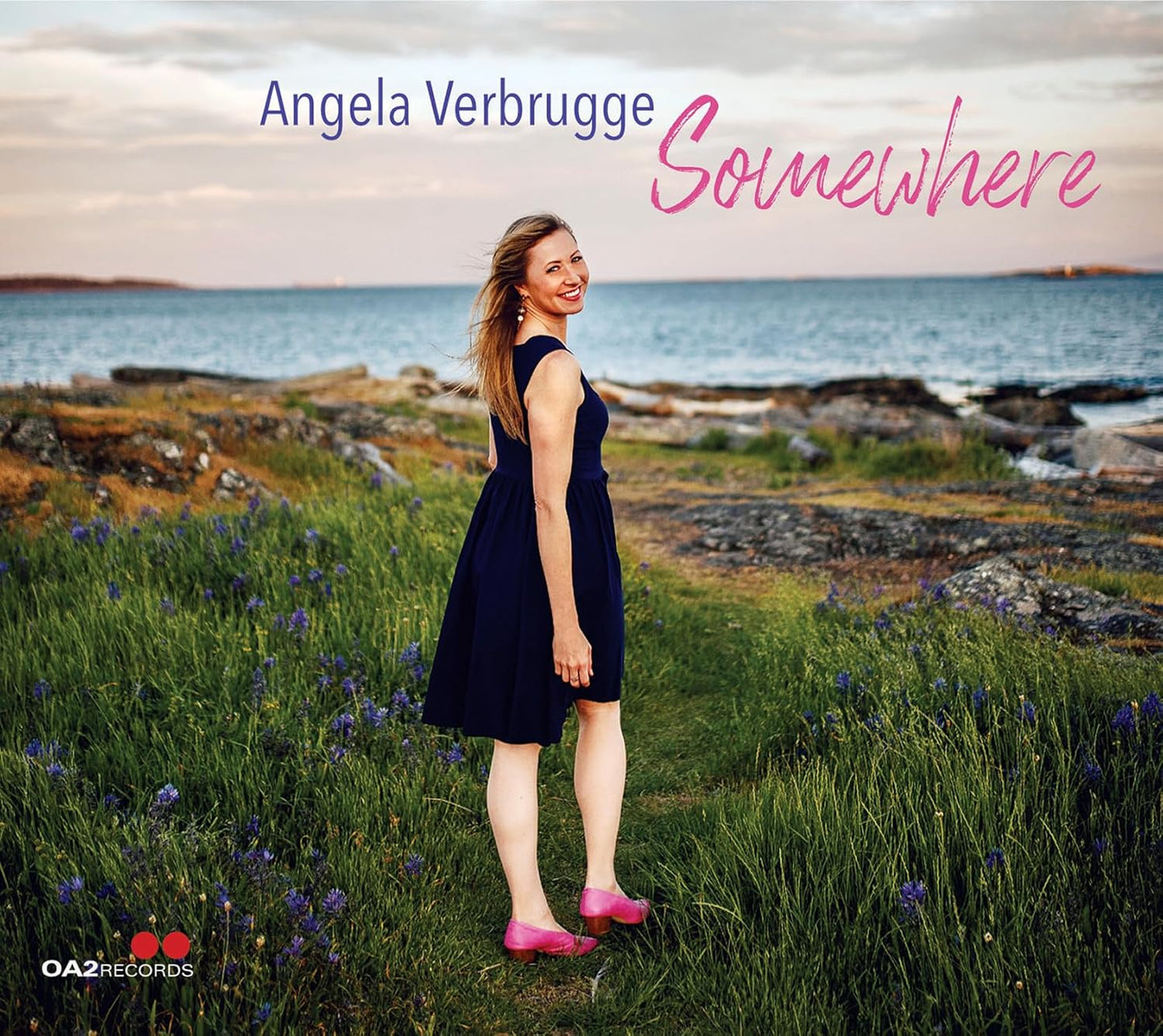 CD cover: Angela Verbrugge standing in a field by the sea.
