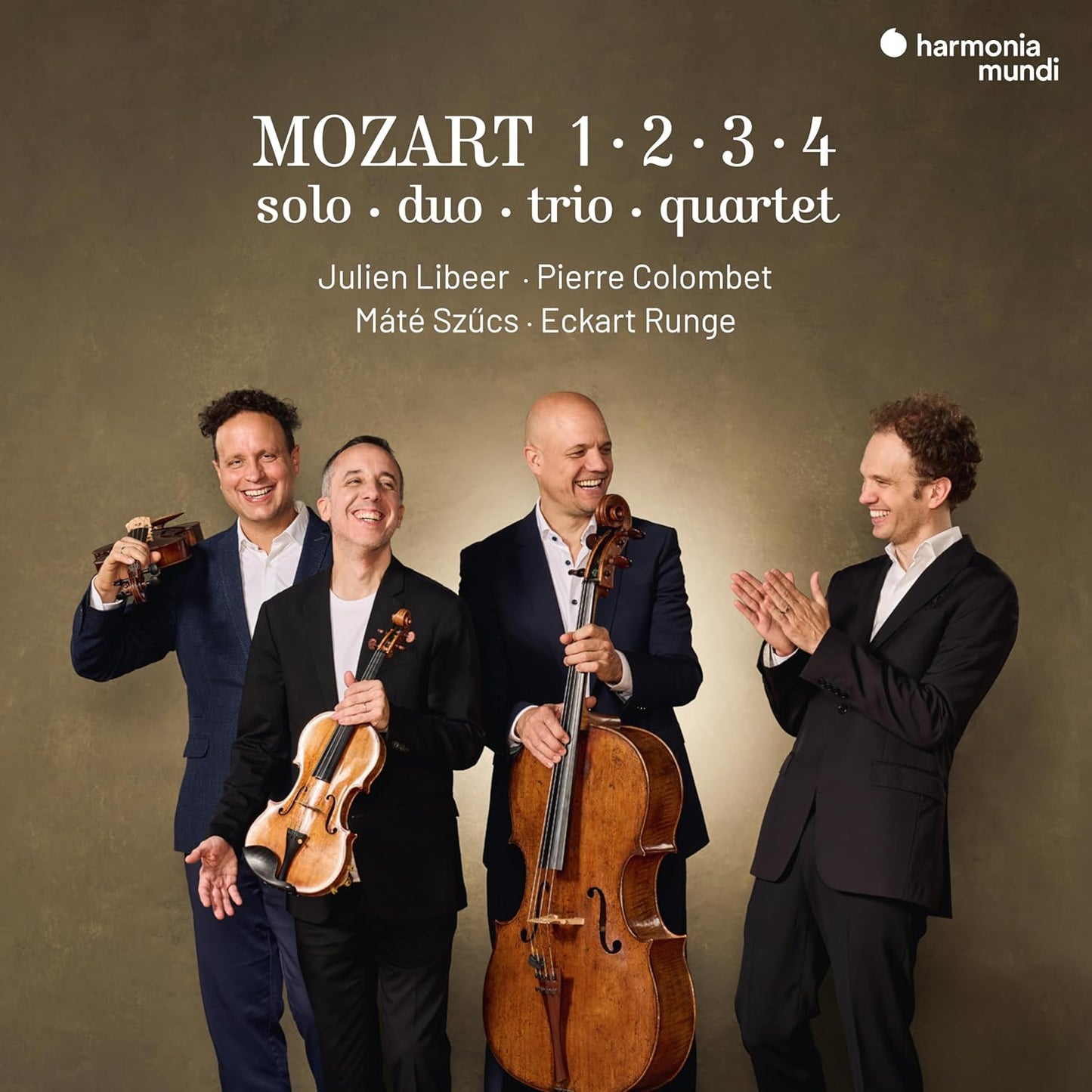Four musicians with string instruments smiling against a muted green background.