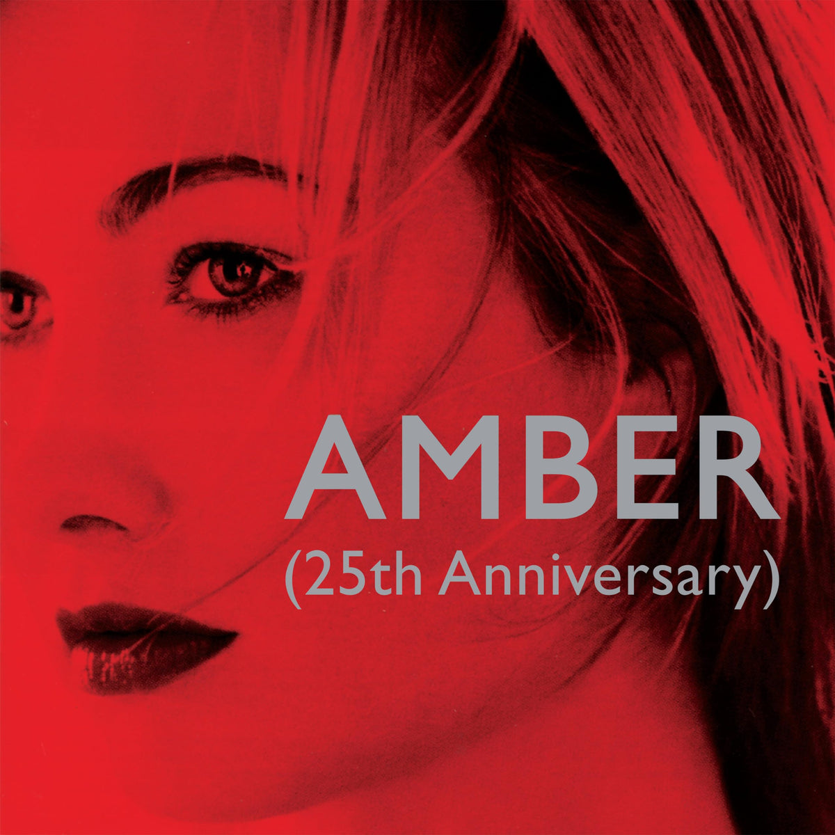 Close-up of a woman’s face with red tones and album title “Amber”.