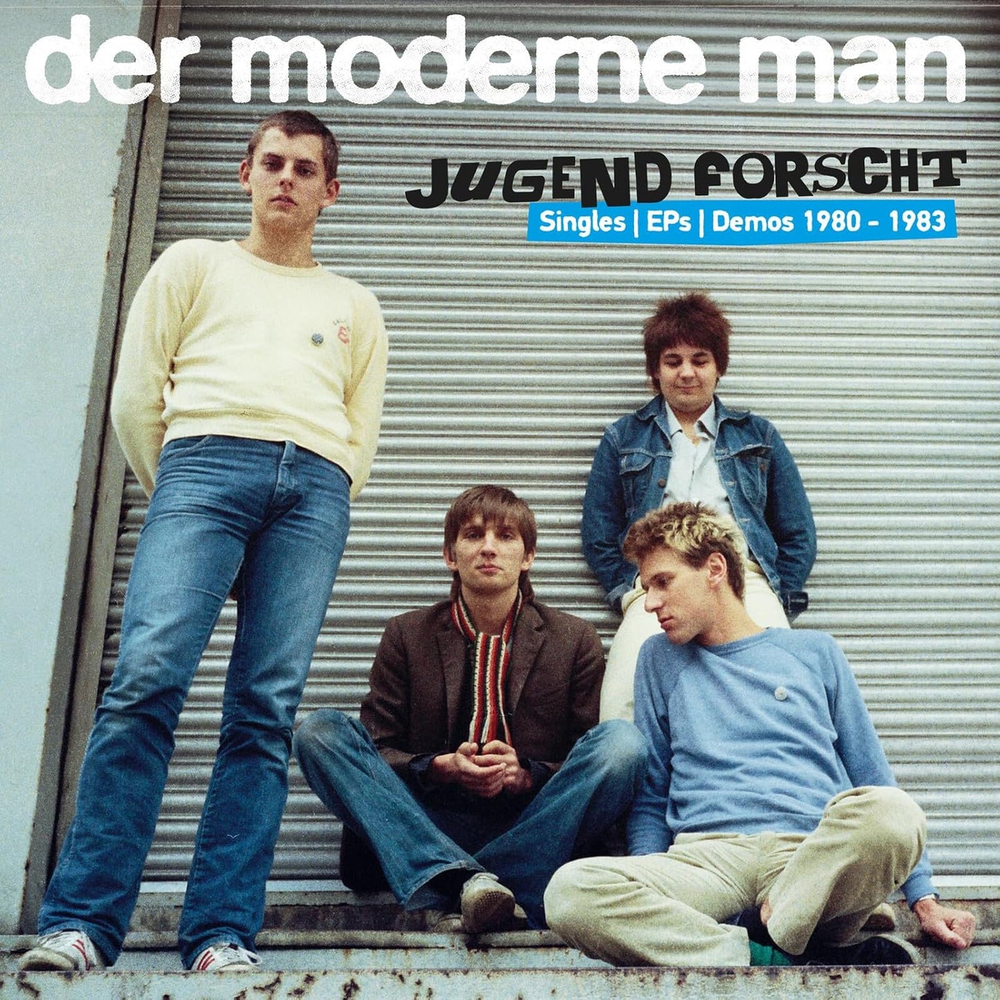 Album cover featuring four young men in 1980s fashion leaning against a metal door.